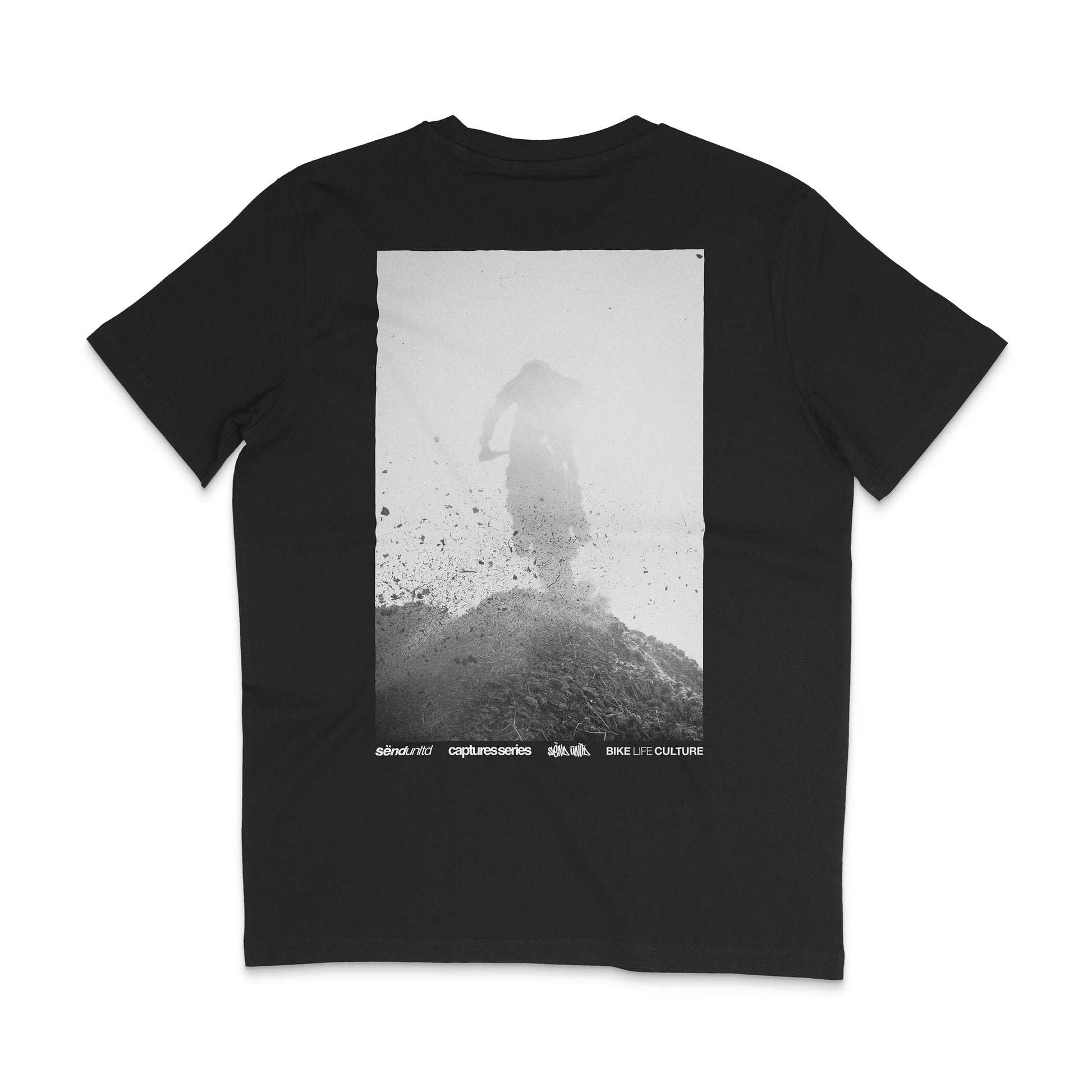 Backside of a black t-shirt with a large photo backprint of a dirt bike jump